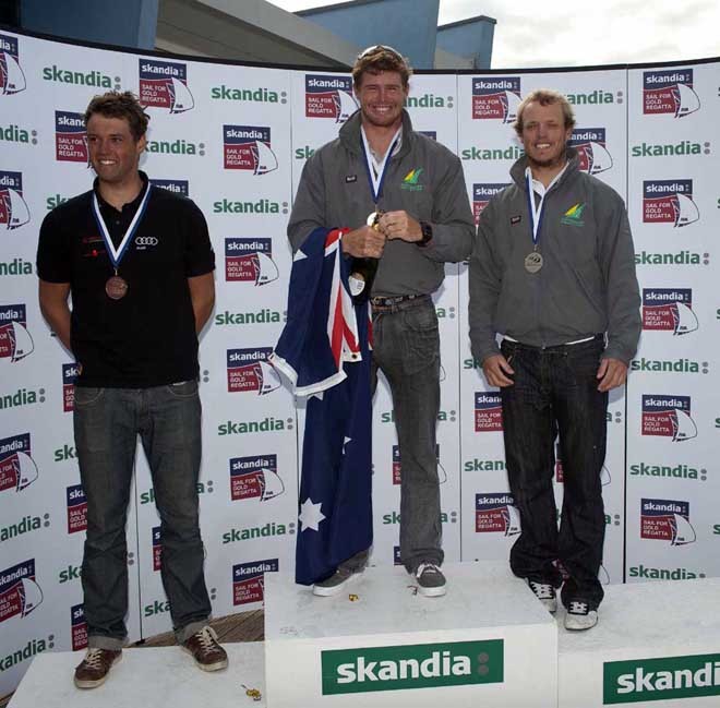 Tom Slingsby (AUS), Tom Burton (AUS), Philipp Buhl (GER) receives awards on Day 6 of the Skandia Sail for Gold Regatta, in Weymouth and Portland, the 2012 Olympic venue. © onEdition http://www.onEdition.com